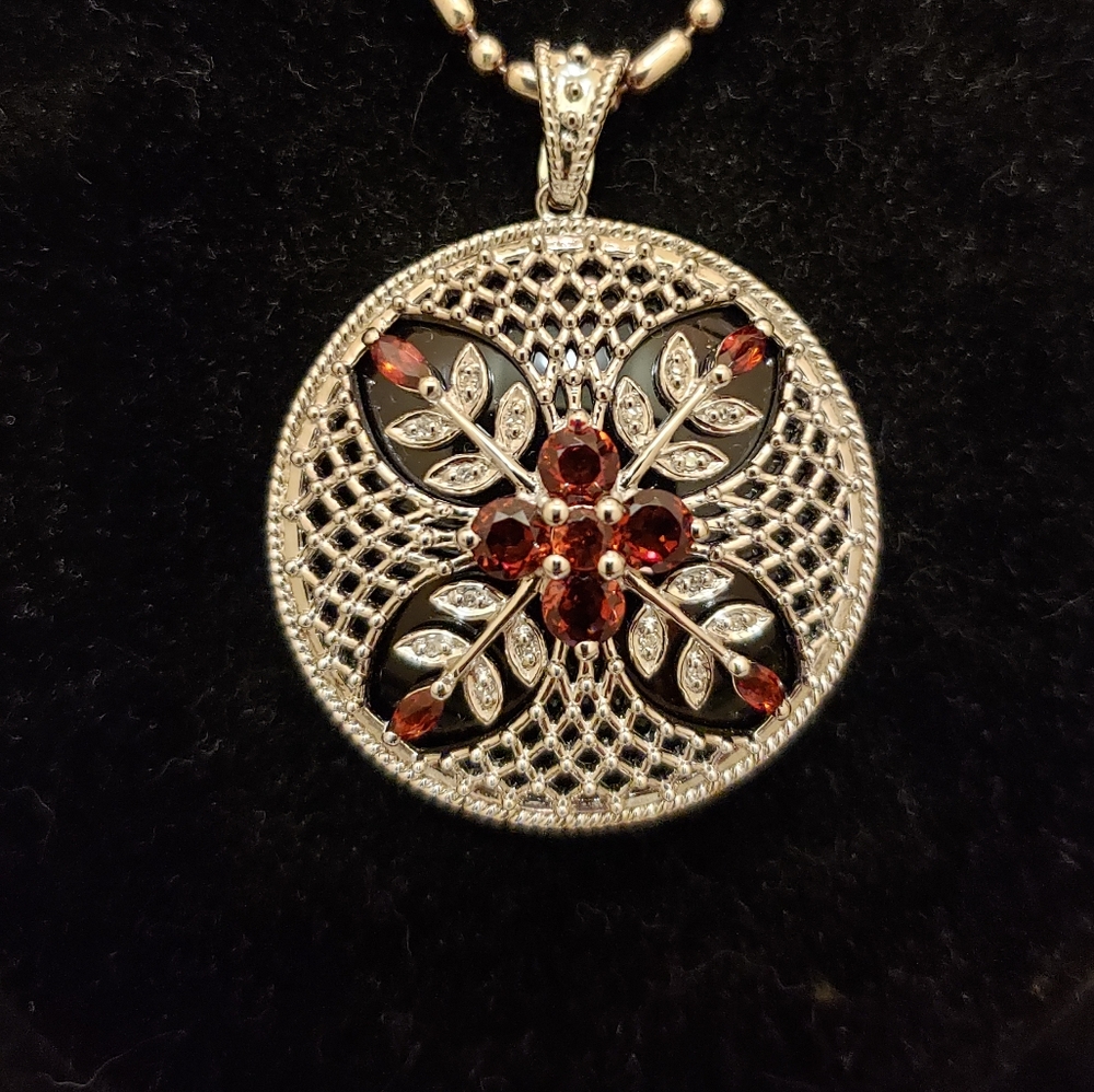 Art Deco style garnet, sterling silver, and onyx